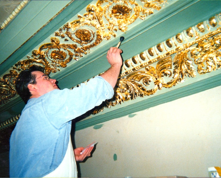 Chris restoring gilded cornice