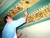 Chris restoring gilded cornice